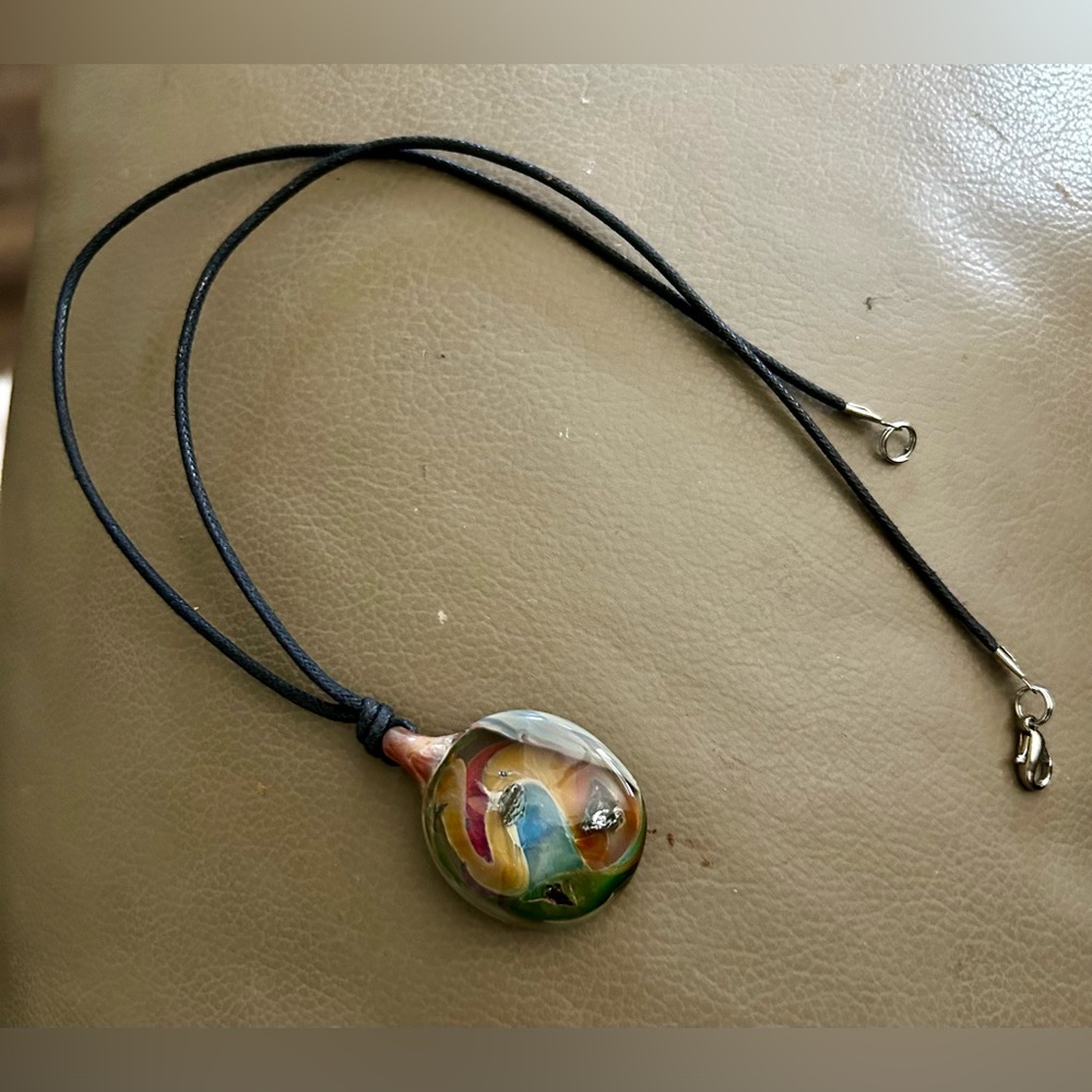 Blown glass pendant on black cord